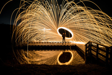 Lightpainting with burning steel wool in the night