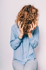 Unrecognizable young woman wearing blue shirt