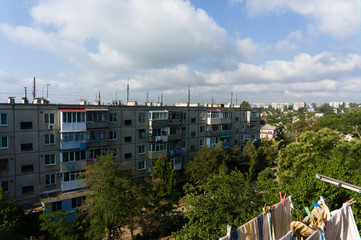Fototapeta na wymiar east european industrialized apartment blocks and balconys in summer