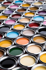 Group of tin metal cans with color paint