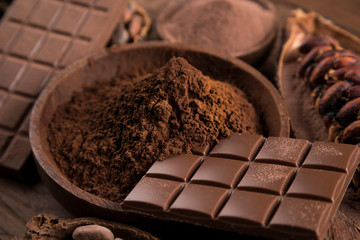 Cocoa beans and chocolate on natural paper background