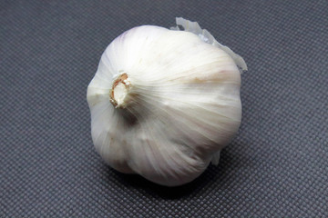 Garlic. Close-up. Isolated object on a black background.