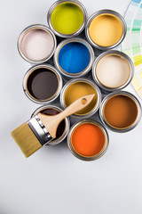 Paint brush, tin can and color guide samples