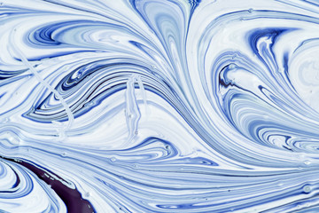 Empty abstract background for layouts. Mixing white and blue paint creating a beautiful pattern.