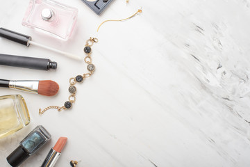 Set of professional cosmetics, makeup tools and accessories on a white marble background with copy space for text. concept of beauty, fashion. flat composition of the frame, top view.Flat lay