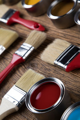 Tin cans with paint and brushes