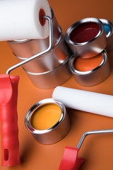 Tin cans with paint and brushes