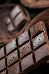 Cocoa beans and chocolate on natural paper background