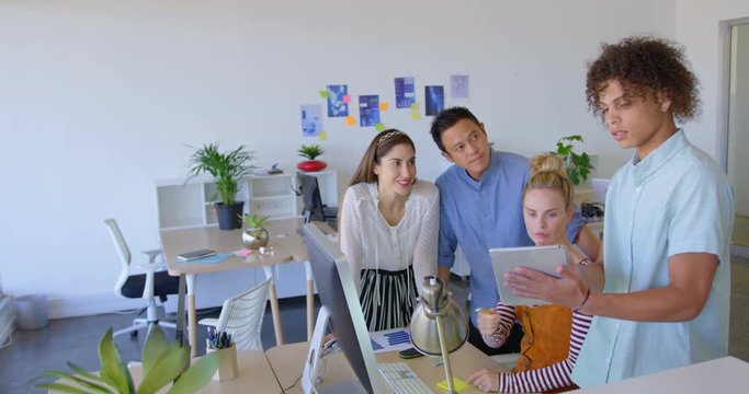 Young metis people holding a notebook and showing this one at his colleagues 4k