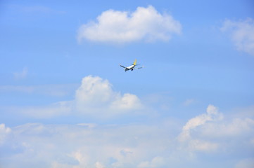 Fototapeta na wymiar speed business airplane in the blue sky
