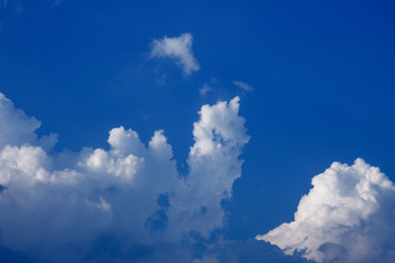 Naklejka na ściany i meble Blue sky with clouds forming drawing in the sky, natural nature