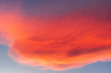 Reddish clouds at sunset over mountains