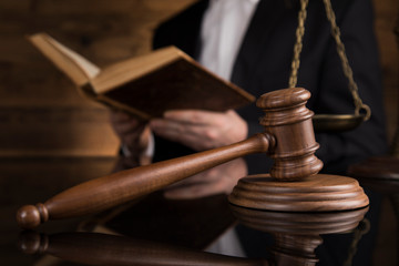 Judge, male judge in a courtroom striking the gavel