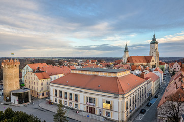 Aerial panorama of  city with red tiled roofs.