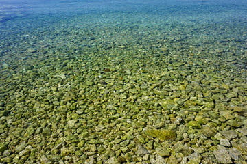 Stone and pebble beach under the seawater