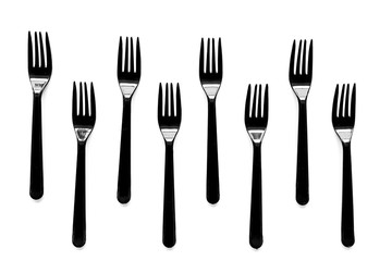 Plastic flatware for eco concept on white background top view pattern