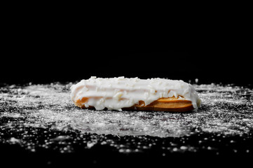 Eclair on black background