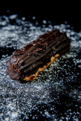 Eclair on black background