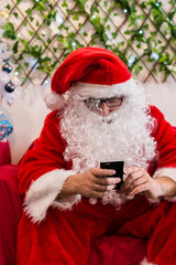 man in santa suit using phone