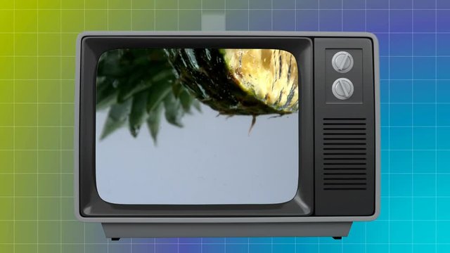 Old TV with pineapple on the screen against grid pattern background