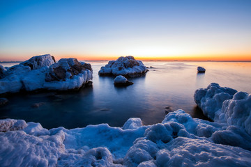 Sunrise by the sea in winter