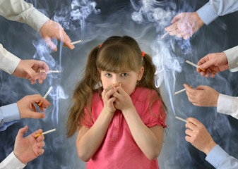Smoking in front of the child kid .A little girl covers her nose from tobacco smoke.Conceptual...