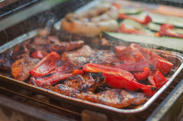 meat and vegetables on the grill