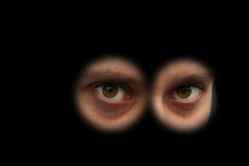 The look of the person looking out of the eyepiece, the concept of spying, peeping, riddles