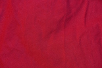 red fabric texture from a piece of crumpled wool