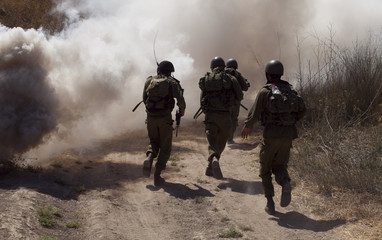 A soldier ran through thick smoke