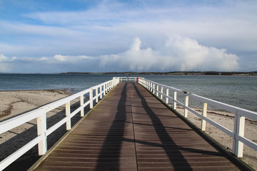 Fototapeta na wymiar Seebrücke an der Ostsee in Howacht Schleswig-Holstein