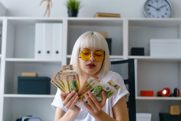 portrait of young pretty businesslady working in office make good bargain get lot of money