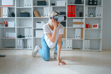 portrait of young pretty businesslady working in office try on glasses of virtual reality