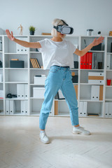 portrait of young pretty businesslady working in office try on glasses of virtual reality