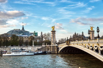 Pont Alexandre III on Seine River with Grand Palais and Petit Palais in background - Paris France