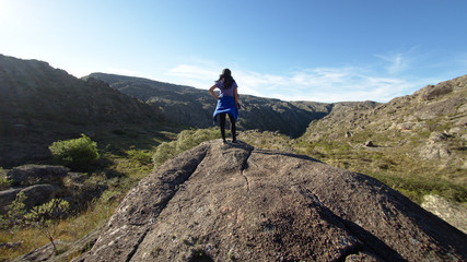 A hiker at Cerro Blanco reserve, near Tanti and Los Gigantes in the Altas Cumbres region, Cordoba,...