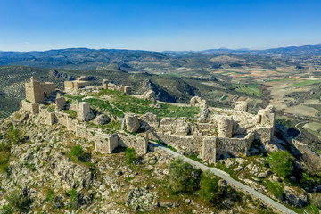 Fototapeta na wymiar Moclin medieval walled town and ruined castle with blue sky aerial panorama