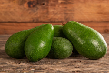 Ripe shiny avocados in head
