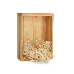 Wooden crate with shavings on white background