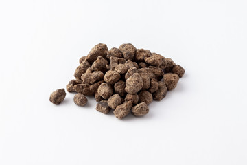 Okinawan black sugar close up on white background