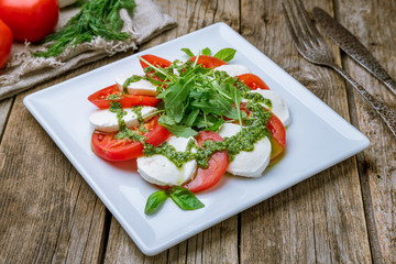 Caprese salad with mozzarella and tomato