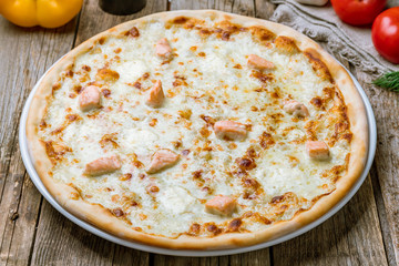 Pizza with salmon and Philadelphia cheese