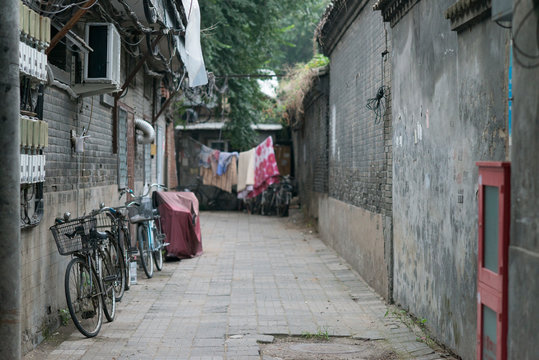 Bikes parked in a hutong, in a street of Beijing, China © LR-PHOTO