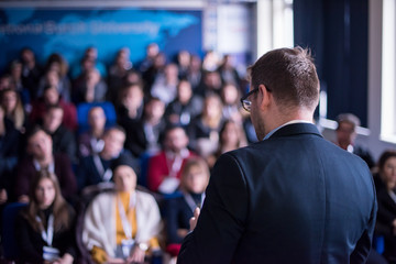 successful businessman giving presentations at conference room