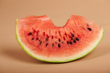 Fresh watermelon piece with bite