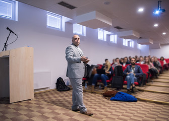 successful businessman giving presentations at conference room