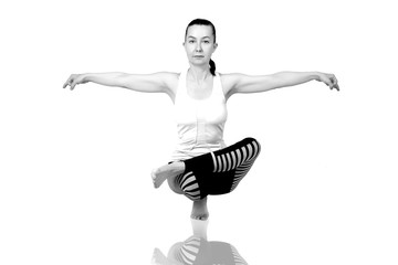 young girl performs different poses of yoga, flexible beautiful model on a white background. meditation and asanas.