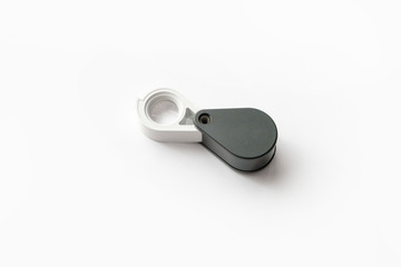 Magnifying glass for diamonds or see the amulet Isolated on a White Background.