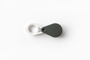 Magnifying glass for diamonds or see the amulet Isolated on a White Background.