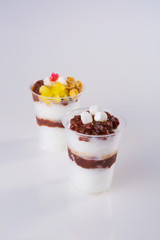 BingSu. adzuki-bean ice dessert. It''s adzuki-bean paste, milk, ice cream, sticky rice cake, fruit cocktail, and stuff like that on shaved ice.  It''s sweet and very refreshing.